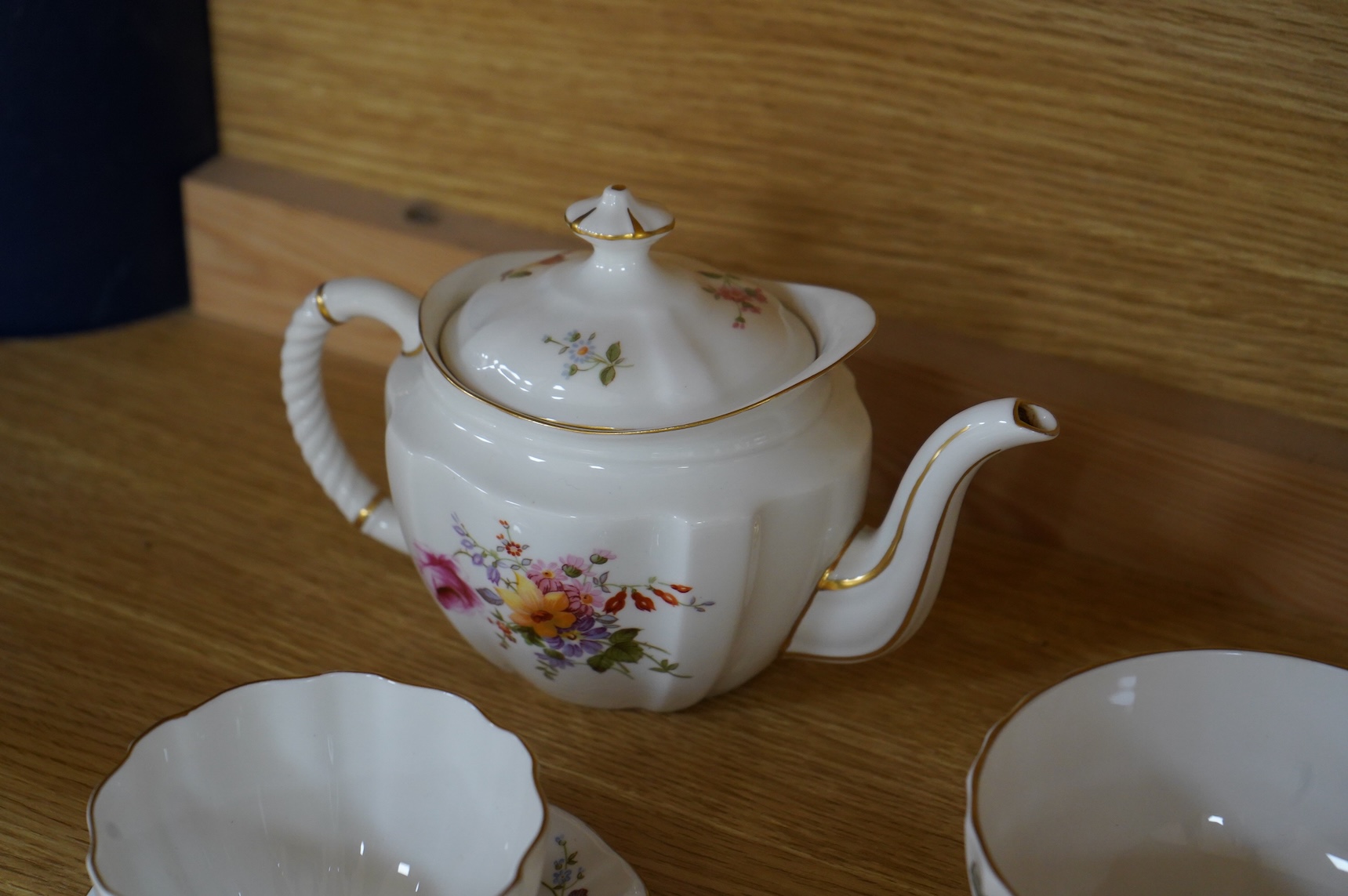 A Royal Crown Derby tea for two set, and a Royal Worcester Lavinia pattern part tea set to include trios, largest 20cm wide